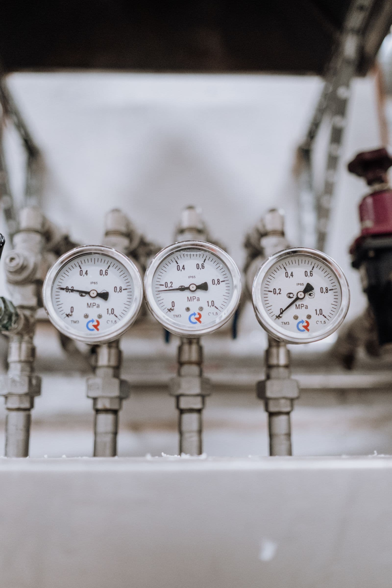 Three pressure gauges on a process line